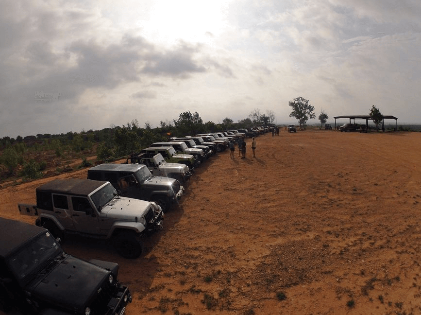 A line of jeeps at the beginning of an off-road trail