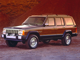 A front corner view of a Jeep Cherokee XJ with the wood panel sides