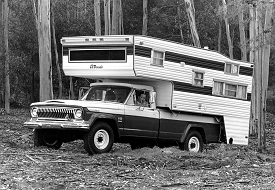 A black & white sideview image of the Jeep J4800 Camper in the woods