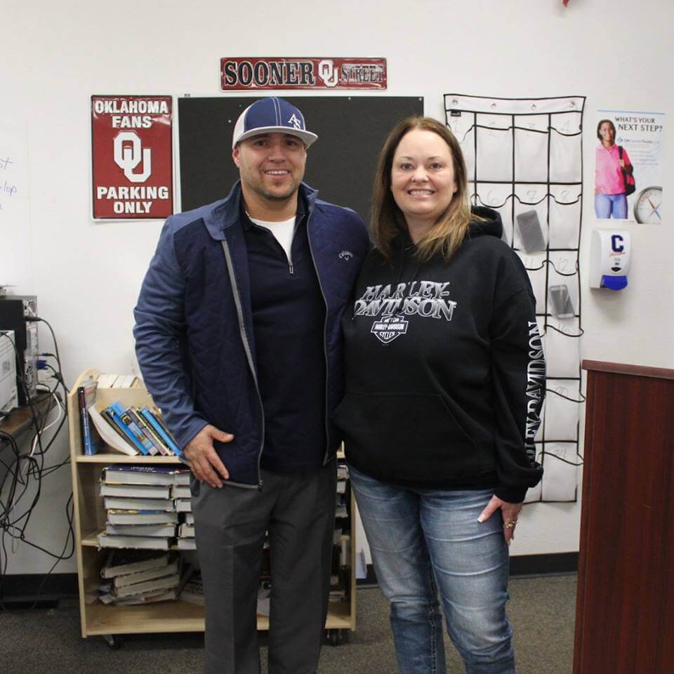 general manager with teacher of the month ms. wood